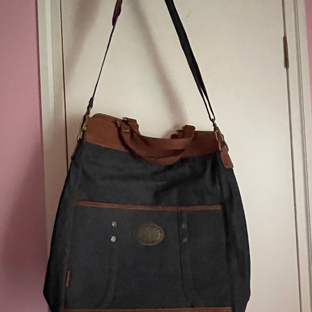 Reba weekend/messenger bag.I assure you all there is no stains on this bag.